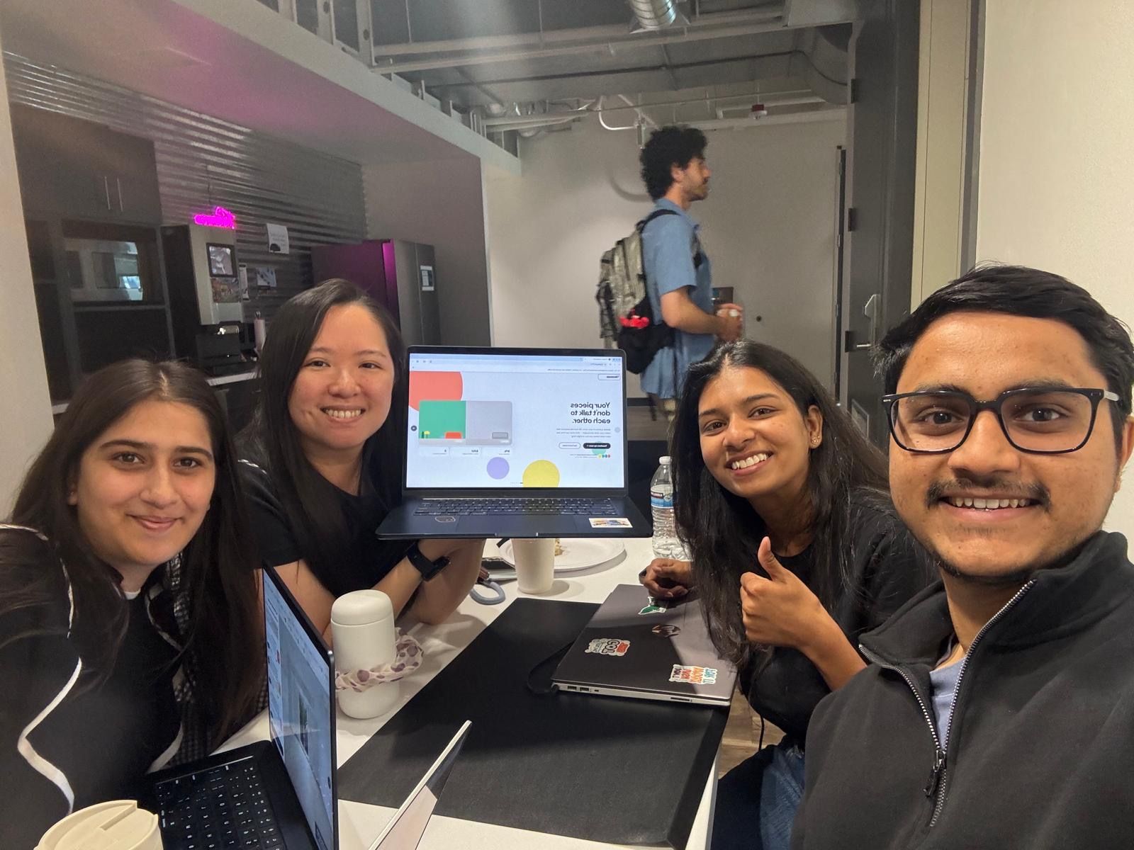 The team after submitting, MoodBoard running on a laptop
